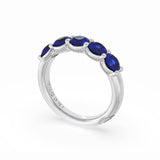 Round Cut Blue Sapphire Eternity Band in 18kt White Gold