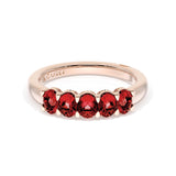 Oval Cut Ruby Eternity Band in 18kt Rose Gold