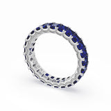 emerald-cut-blue-sapphire-eternity-band-in-18kt-white-gold-419w65bs