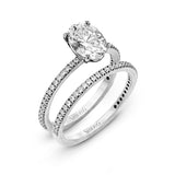 Oval-cut Engagement Ring & Matching Wedding Band in 18k Gold with Diamonds