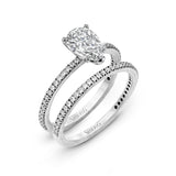 Pear-cut Engagement Ring & Matching Wedding Band in 18k Gold with Diamonds