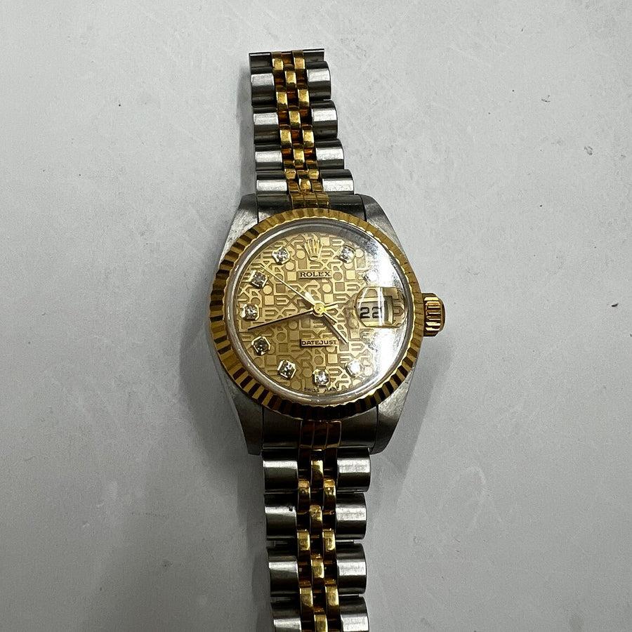Authentic recently purchased two-tone patterned-dial watch
