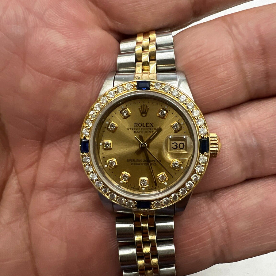 Authentic recently purchased two-tone watch held in hand
