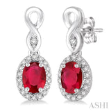 5x3 MM Oval Cut Ruby and 1/6 Ctw Round Cut Diamond Earrings in 14K White Gold