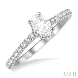 1/2 ctw Round Cut Diamond Engagement Ring With 1/4 ctw Oval Cut Center Stone in 14K White Gold