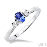 5x3mm Oval Cut Tanzanite and 1/20 Ctw Round Cut Diamond Ring in 10K White Gold