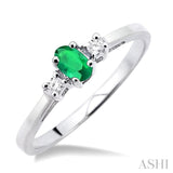 5x3mm Oval Cut Emerald and 1/20 Ctw Round Cut Diamond Ring in 10K White Gold