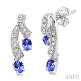 4x3MM Oval Cut Tanzanite and 1/5 Ctw Round Cut Diamond Earrings in 14K White Gold